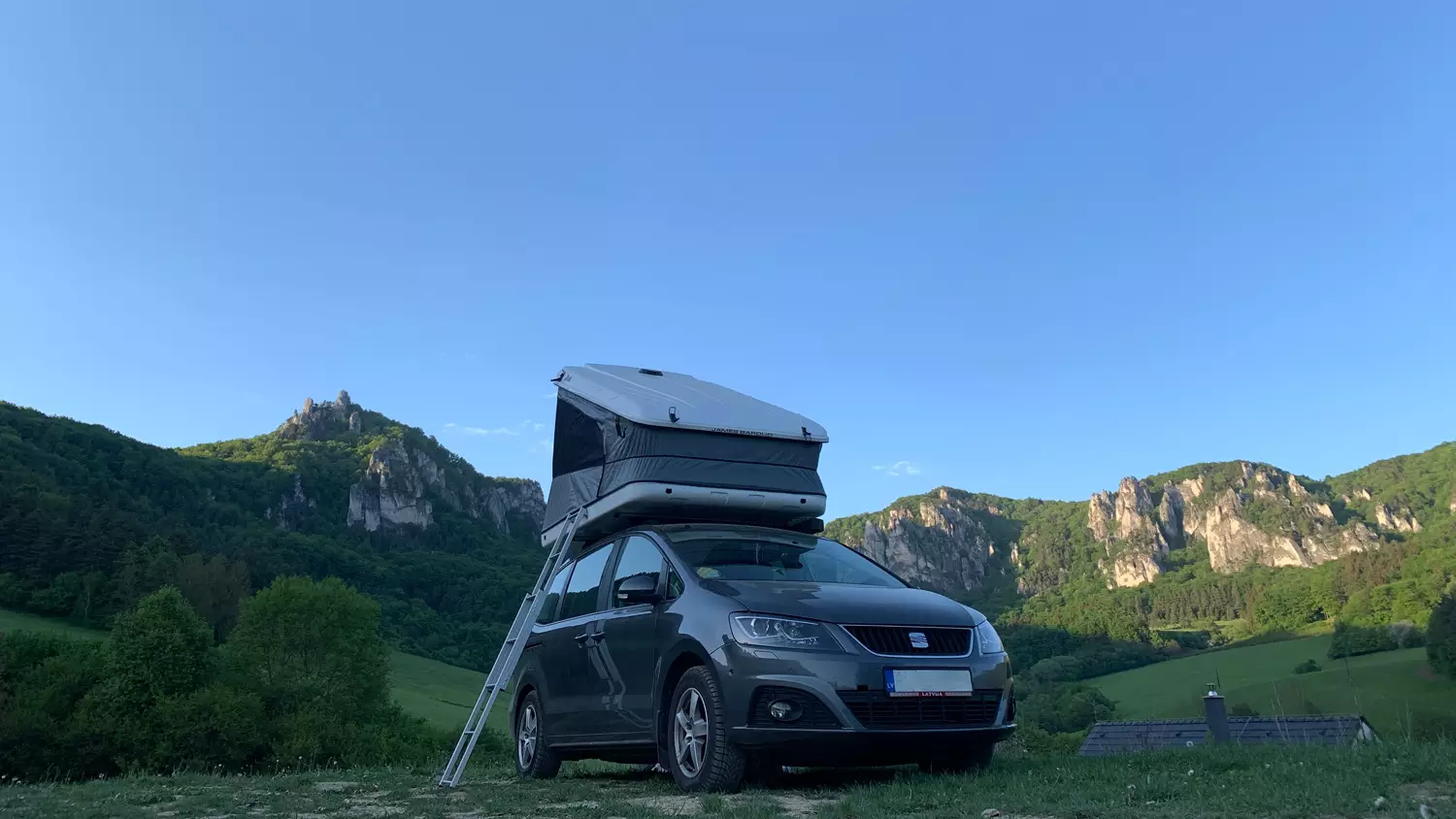 Artūrs Kozlovskis @karturs family camping with his Space rooftop tent in the Lavian landscape