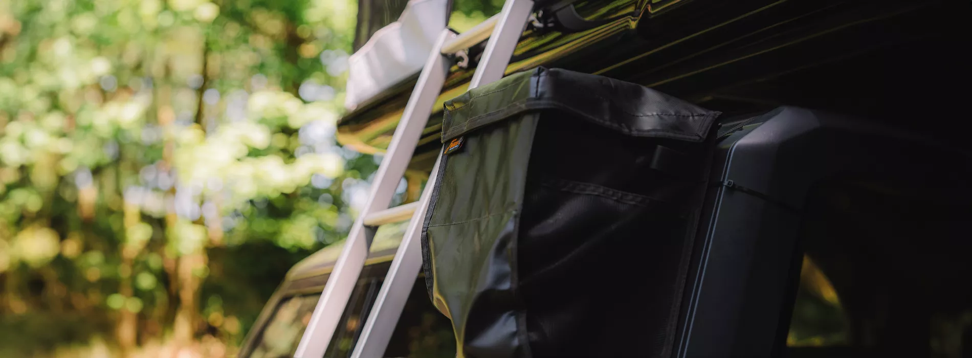 James Baroud Adventure Bag attached next to the Rooftop Tent ladder