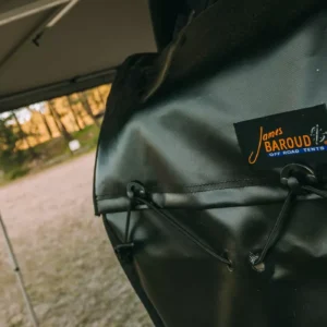Detailed view of James Baroud Eco Bag effortlessly attached to the tire for ultimate outdoor convenience