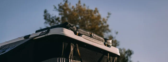 James Baroud Gear Bag on top of Open Grand Raid Rooftop Tent