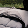 James Baroud TBS bedding system partially opened inside a rooftop tent